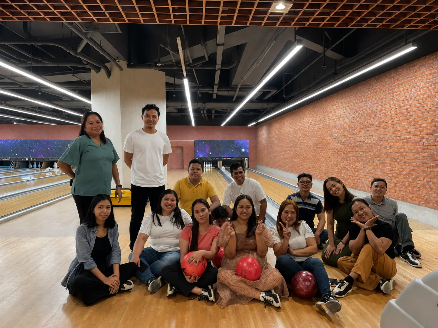 The Zion-Rose Financials team together at a bowling activity